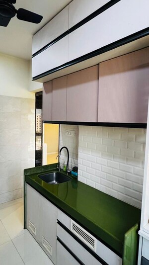 Kitchen in 2 BHK Apartment at Rustomjee Alpine, Malad West – for Rent