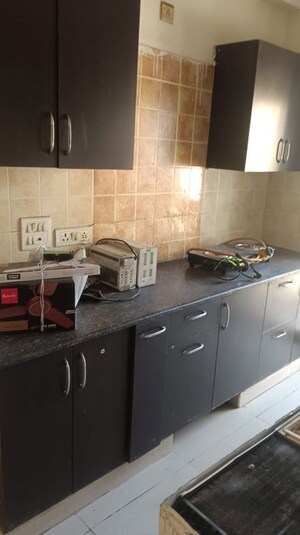 Kitchen in 2 BHK Apartment at Aims Golf City, Sector 75 – for Sale