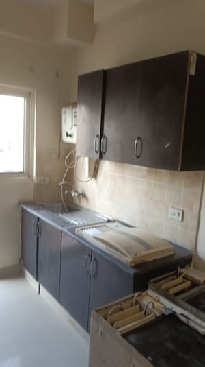 Kitchen in 2 BHK Apartment at Aims Golf City, Sector 75 – for Sale