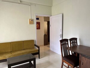Living Room in 1 BHK Apartment at Manohar Mahal CHS, Mahim – for Rent