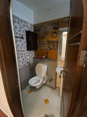 Bathroom in 2 BHK Apartment at Eros Southend Apartments, Charmwood Village – for Rent