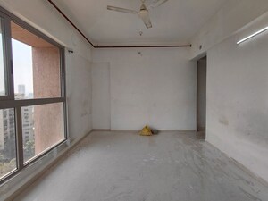 Room in 2.5 BHK Apartment at The Wadhwa Anmol Fortune, Goregaon West – for Sale