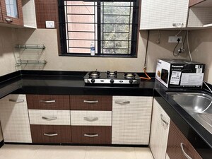 Kitchen in 2 BHK Apartment at Hiranandani Estate Queens, Ghodbunder Road – for Rent