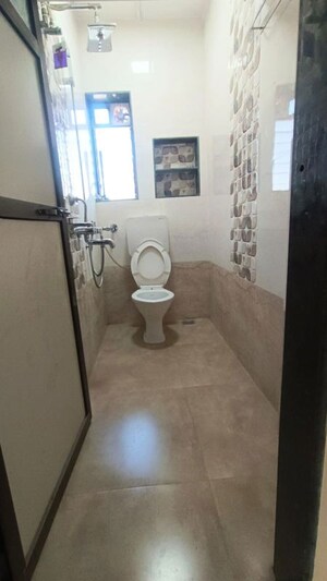 Bathroom in 2 BHK Apartment at Chandravadan CHS, Ganeshwadi – for Rent