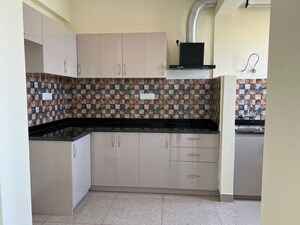 Kitchen in 2 BHK Apartment at Ahad Serenity, Rayasandra – for Rent