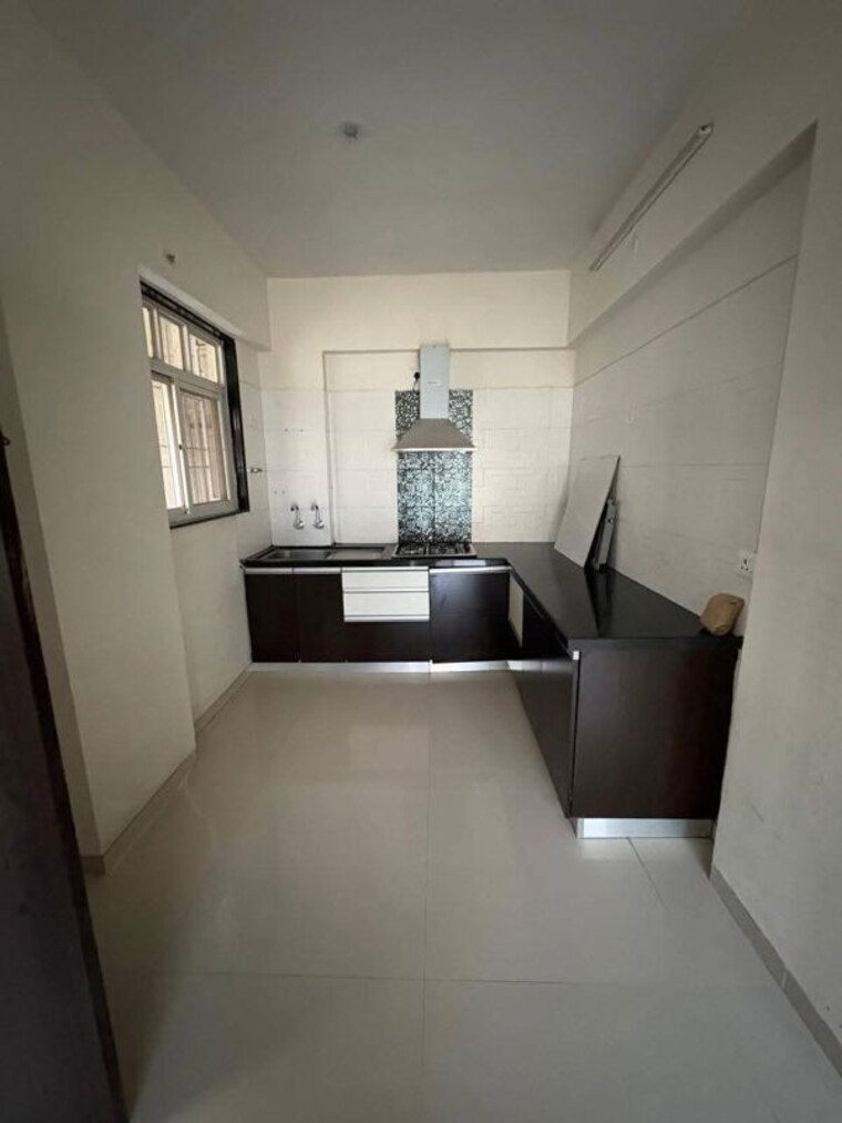 Kitchen, jhamtani-ace-almighty-phase-i 2 Bedroom 760 Sq.Ft. Apartment In Wakad Pune 10182646