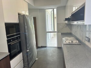 Kitchen in 5 BHK Apartment at DLF Square, Sector 25 – for Sale