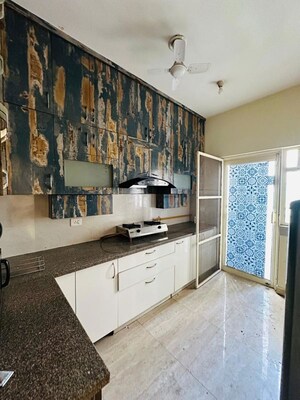 Kitchen in 3.5 BHK Builder Floor at Puri Aman Vilas, Sector 89 – for Rent