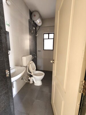 Bathroom in 3 BHK Apartment at Kolte Patil Margosa Heights, Mohammadwadi – for Rent