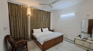 Bedroom in 3 BHK Builder Floor at Nehru Enclave – for Rent
