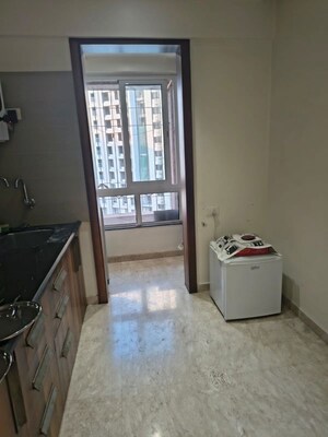 Kitchen in 1 BHK Apartment at Puranik Rumah Bali, Ghodbunder Road – for Rent