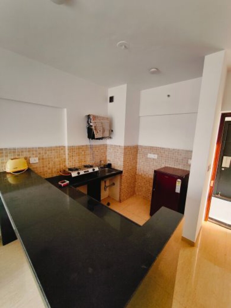 Kitchen, lodha-belmondo Studio 600 Sq.Ft. Apartment In Gahunje Pune 10189262