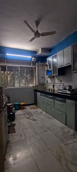 Kitchen in 2 BHK Apartment at Palace Orchard CHS, Mohammadwadi – for Sale