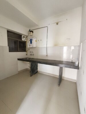 Kitchen in 2 BHK Apartment at Majestique Rhythm County, Handewadi – for Rent