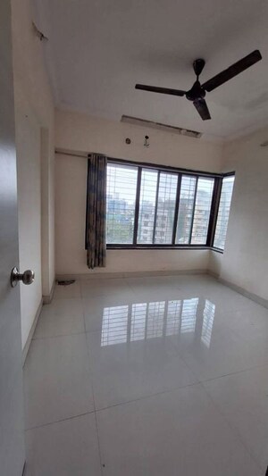 Room in 2 BHK Apartment at Satyam CHS Goregaon West, Goregaon West – for Rent