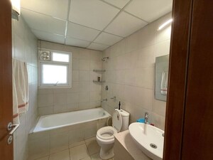 Bathroom in 3 BHK Apartment at Bhartiya Nikoo Homes, Thanisandra Main Road – for Rent