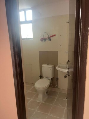 Bathroom in 2 BHK Apartment at Charms Castle, Raj Nagar Extension – for Rent