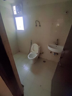 Bathroom in 2 BHK Apartment at Charms Castle, Raj Nagar Extension – for Rent