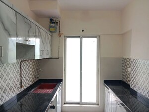 Kitchen in 2 BHK Apartment at Shree Tirupati STG Signature Residency, Patlipada – for Rent