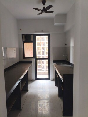Kitchen in 2 BHK Apartment at Runwal Gardens Phase I, Dombivli East – for Rent