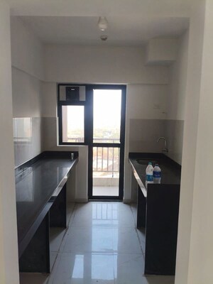 Kitchen in 2 BHK Apartment at Runwal Gardens Phase I, Dombivli East – for Rent