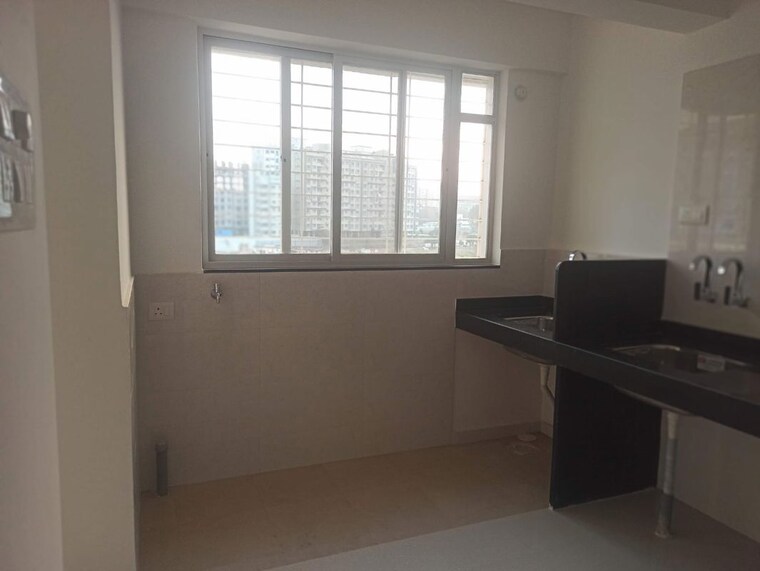 Kitchen, millennium-atlas 2 Bedroom 1100 Sq.Ft. Apartment In Tathawade Pune 10191732