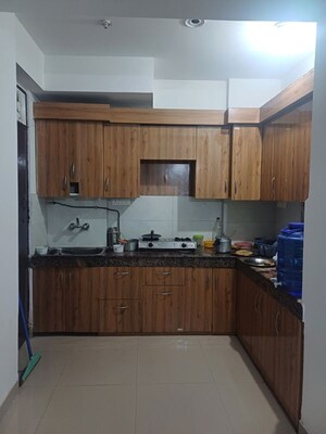 Kitchen in 3 BHK Apartment at AFOWO Raksha Addela, Sector 16c Greater Noida – for Rent