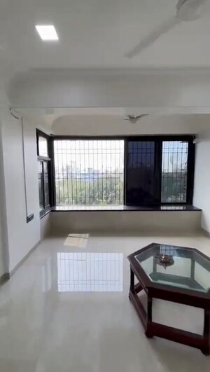 Living Room in 2 BHK Apartment at Sanjeev Enclave, Andheri West – for Rent