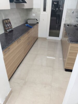 Kitchen in 3 BHK Apartment at ATS Homekraft Pious Hideaways, Sector 150 – for Rent