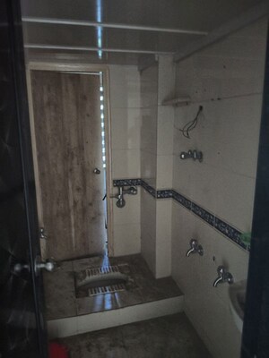 Bathroom in 2 BHK Apartment at Lok Raunak Phase II, Andheri East – for Sale