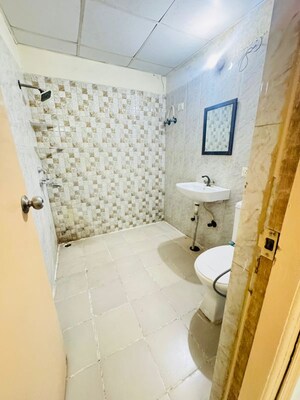 Bathroom in 3 BHK Apartment at Antriksh Golf View, Sector 78 – for Rent