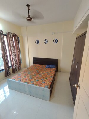 Bedroom in 1 BHK Apartment at Garden Court, Waghbil – for Rent