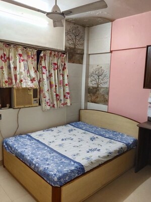 Bedroom in 2 BHK Apartment at Manish Lotus CHS, Andheri West – for Rent