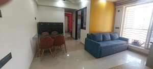 Living Room in 1 BHK Apartment at Agarwal Trinity Towers, Malad West – for Rent
