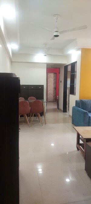 Living Room in 1 BHK Apartment at Agarwal Trinity Towers, Malad West – for Rent