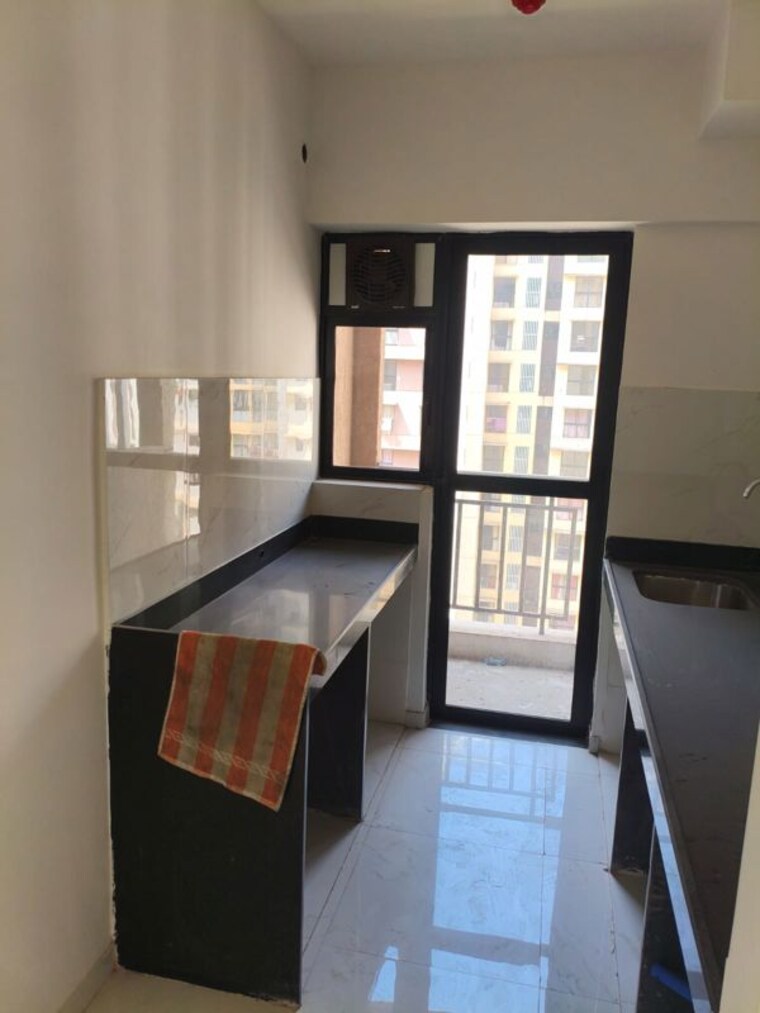 Kitchen, runwal-gardens-phase-2 1.5 Bedroom 696 Sq.Ft. Apartment In Dombivli East Thane 10199235