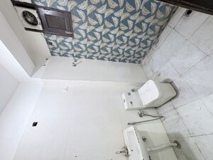 Bathroom in 1.5 BHK Builder Floor at Khirki Extension – for Rent