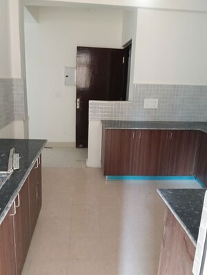 Kitchen in 4 BHK Apartment at Amrapali Heartbeat City, Sector 107 – for Sale