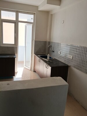 Kitchen in 4 BHK Apartment at Amrapali Heartbeat City, Sector 107 – for Sale