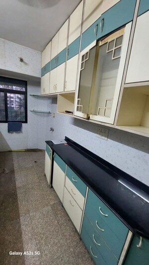 Kitchen in 2 BHK Apartment at Arpan Darpan CHS, Goregaon East – for Rent