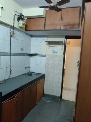 Kitchen in 1 BHK Apartment at Lok Upvan Apartment Phase 2, Vasant Vihar – for Sale