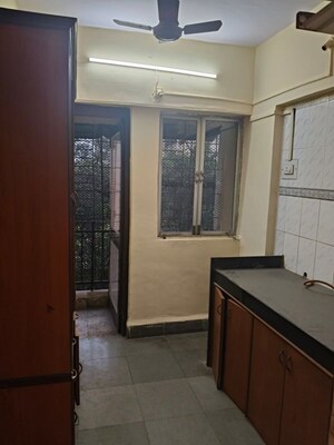 Kitchen in 1 BHK Apartment at Lok Upvan Apartment Phase 2, Vasant Vihar – for Sale