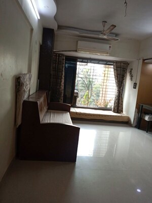 Living Room in 1 BHK Apartment at Kalpataru Shravasti, Malad West – for Rent