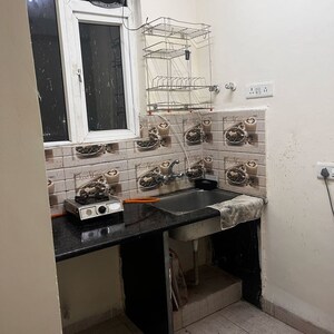 Kitchen in 1 RK Apartment at Urbtech Xaviers, Sector 168 – for Rent