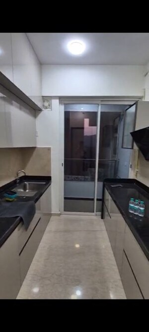 Kitchen in 2 BHK Apartment at Courtyard by Narang Realty and The Wadhwa Group, Pokhran Road No Two – for Rent