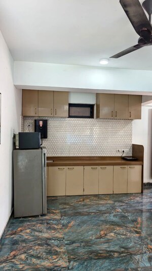 Kitchen in 2 BHK Apartment at Squarefeet Ace Square phase 2, Ghodbunder Road – for Rent