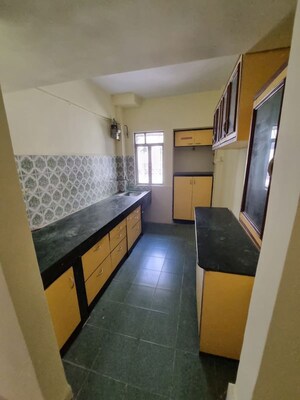 Kitchen in 2 BHK Apartment at Green Acres Apartment, Waghbil – for Rent