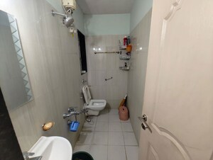 Bathroom in 2 BHK Apartment at Puranik City, Kasarvadavali – for Rent