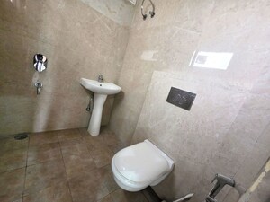 Bathroom in 2 BHK Apartment at Dhakoli – for Sale