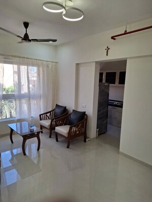 Living Room in 1 BHK Apartment at JP Eminence, Andheri West – for Rent
